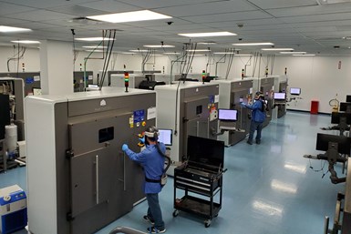 Operators at metal 3D printers